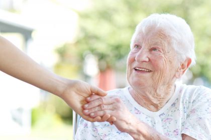 elder_services An elderly woman receives a helping hand